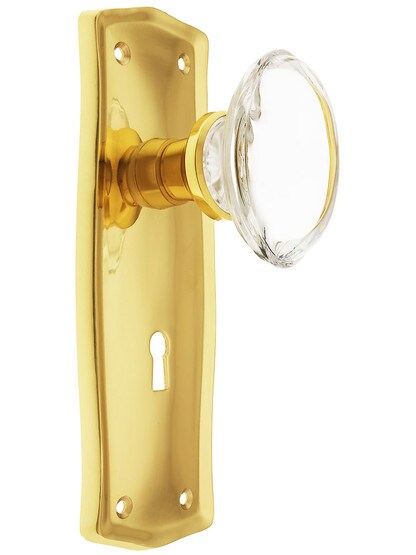 Prairie Plate with Oval Clear Crystal Knob with Keyhole in Polished Brass.